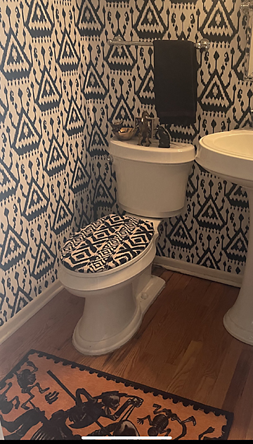 black and white matched wallpaper and toilet lid cover
