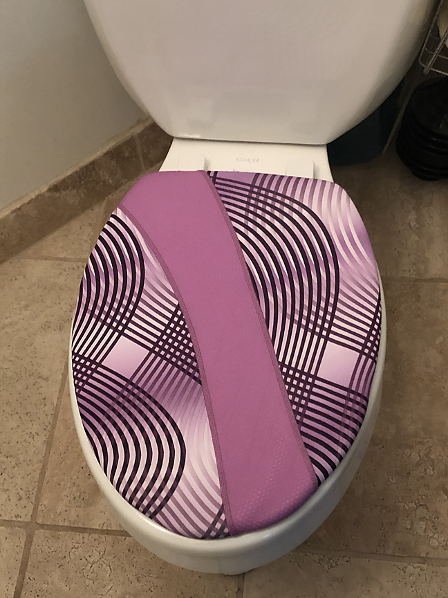 pink and purple toilet seat lid cover brightens the loo